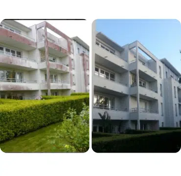 Nettoyage de façade d'un immeuble à balcons derrière une haie
